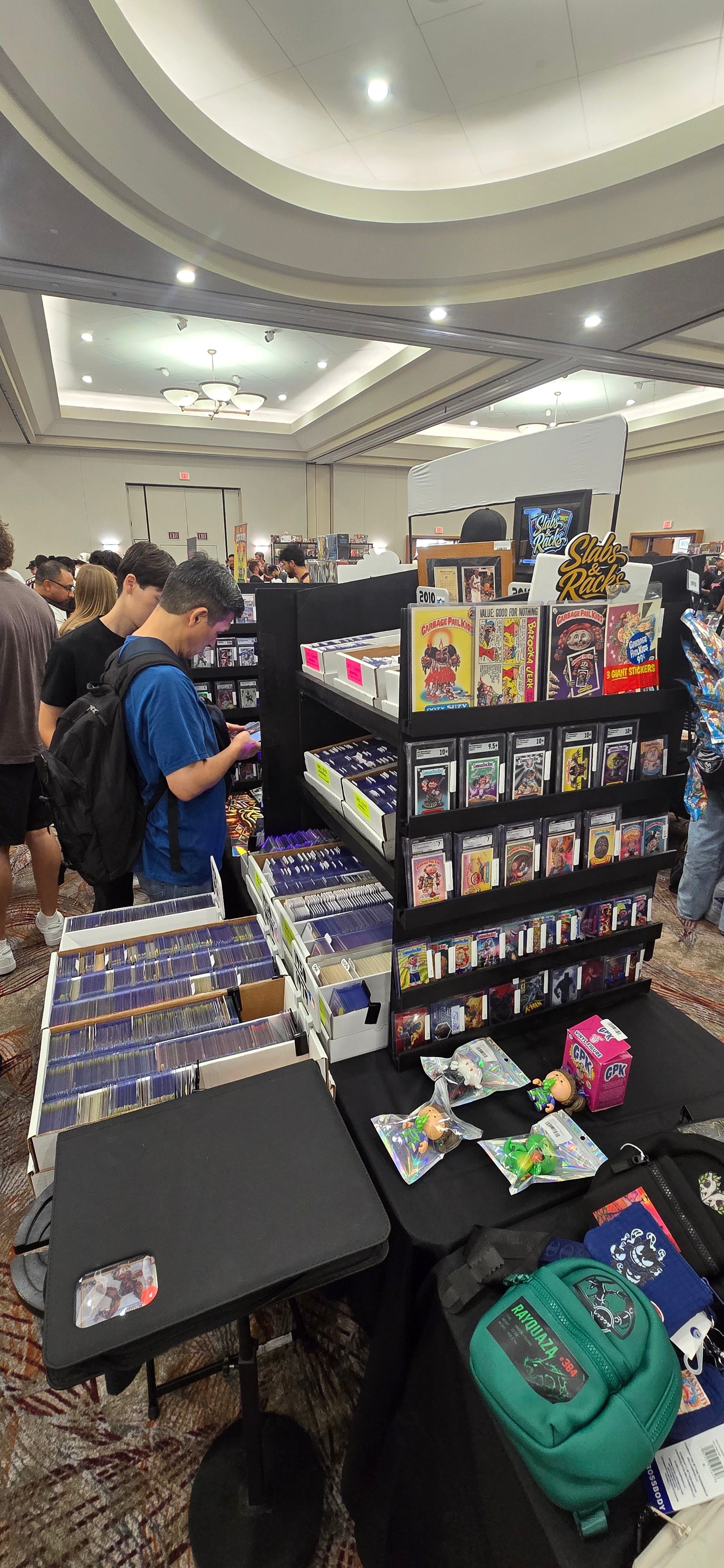 Collectors at the Slabs & Racks table at a card show
