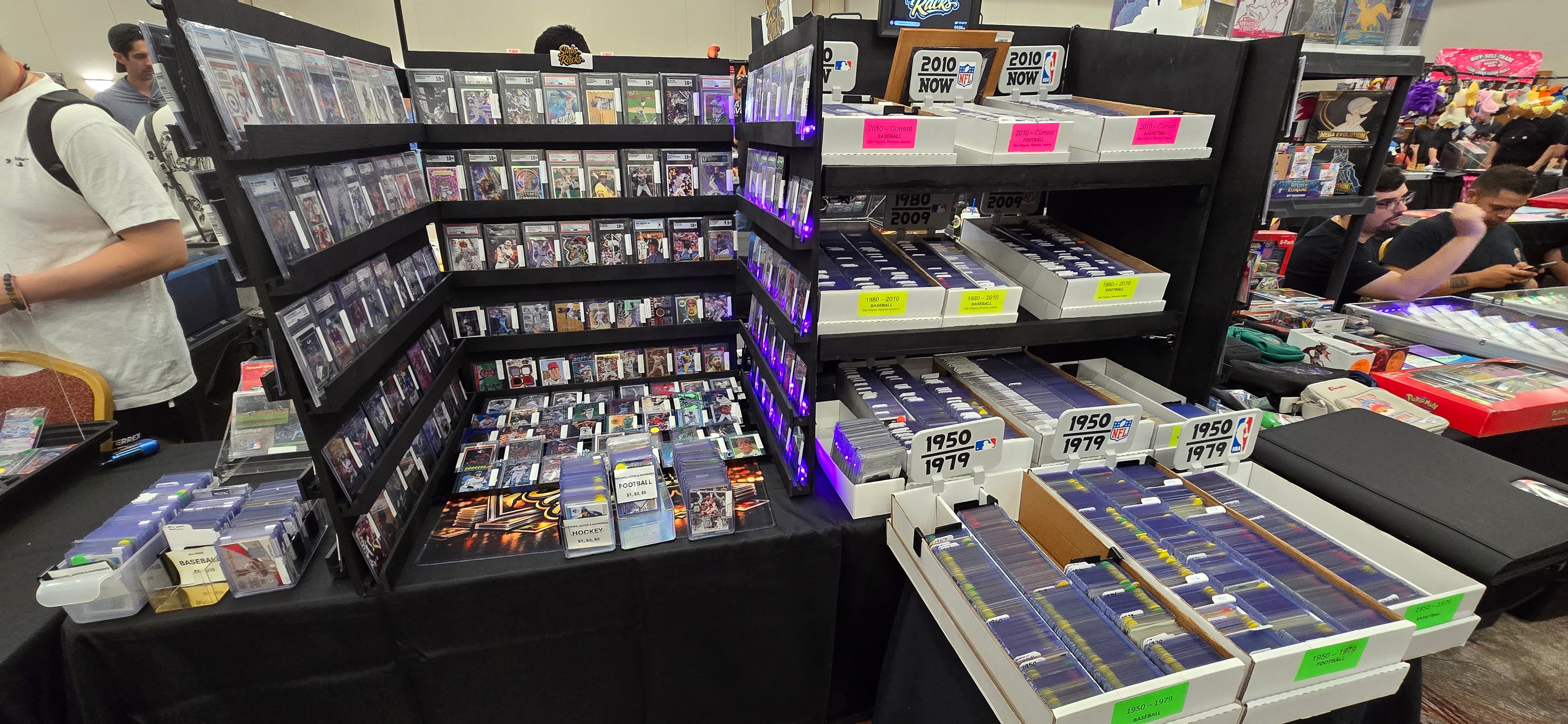 Card show floor with Slabs & Racks booth